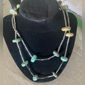 Turquoise stones with pewter beads.  EUC